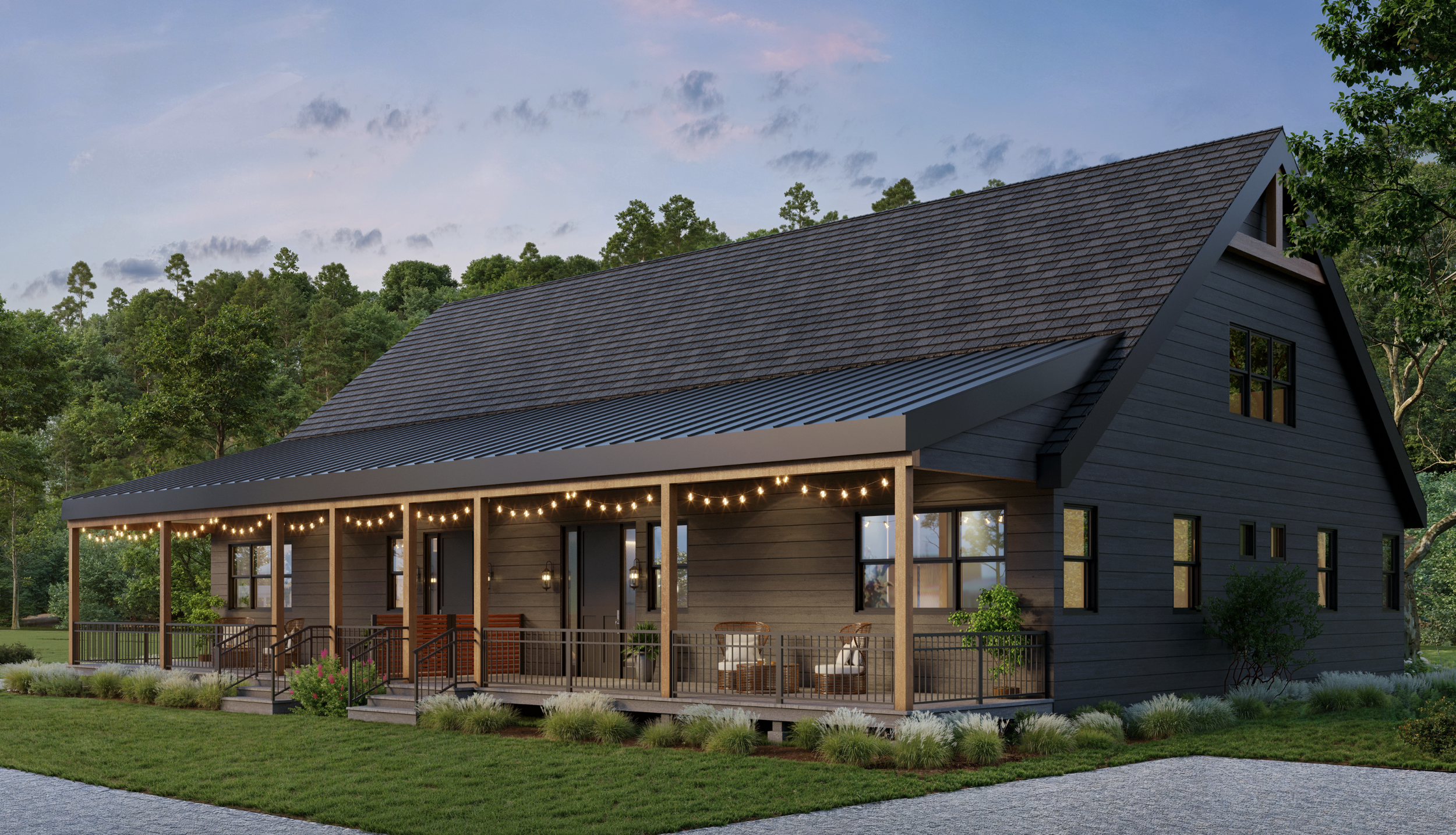 Modern dark gray farmhouse with a front porch, string lights, and outdoor seating, surrounded by green grass and trees at dusk.