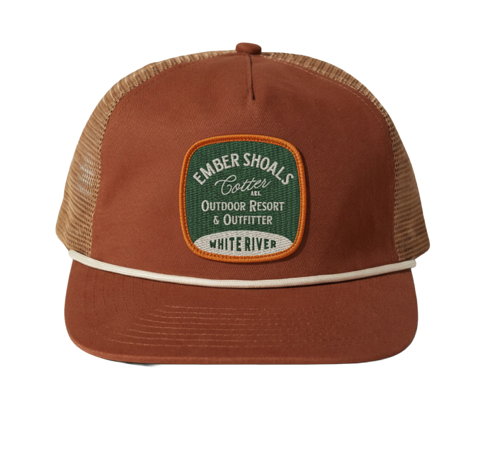 A brown and beige trucker hat with an embroidered patch that reads "Ember Shoals Cotter AEL Outdoor Resort & Outfitter White River."