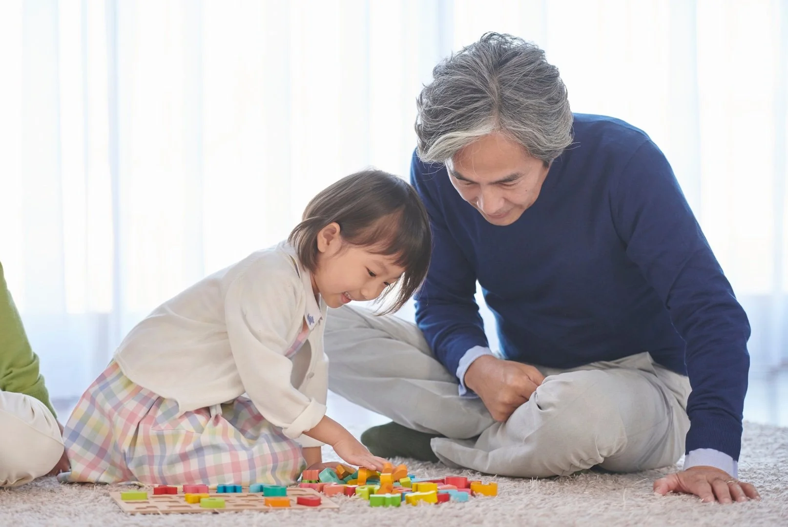 Man playing with his daughter. He just underwent LASIK eye surgery.