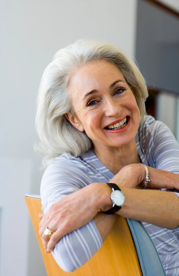 Old woman feeling relieved after her blepharoplasty surgery.