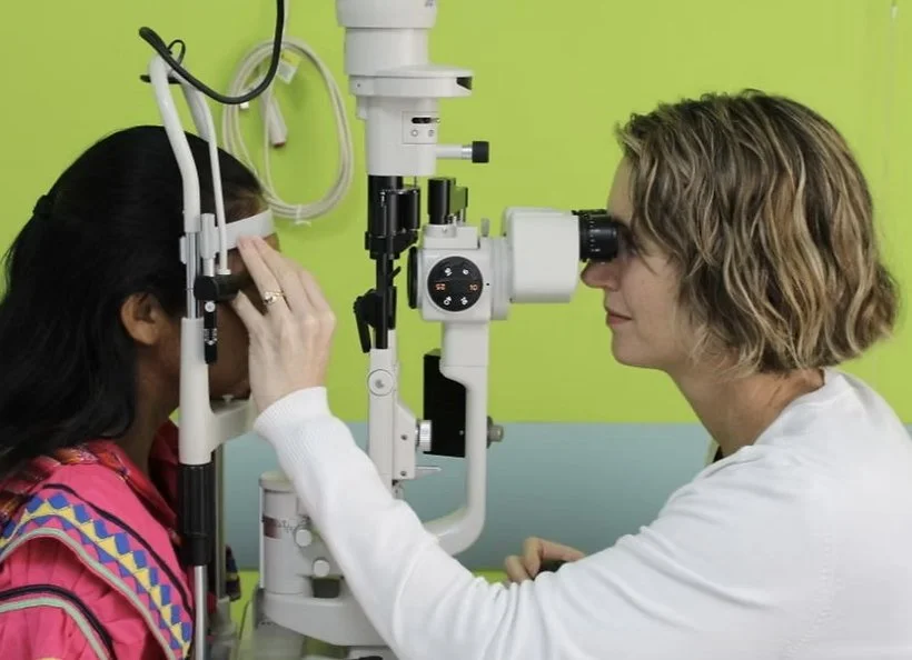 Dr. Erin while testing a patient. She provided cataract surgery services and trained surgeons in South America and the Caribbean.