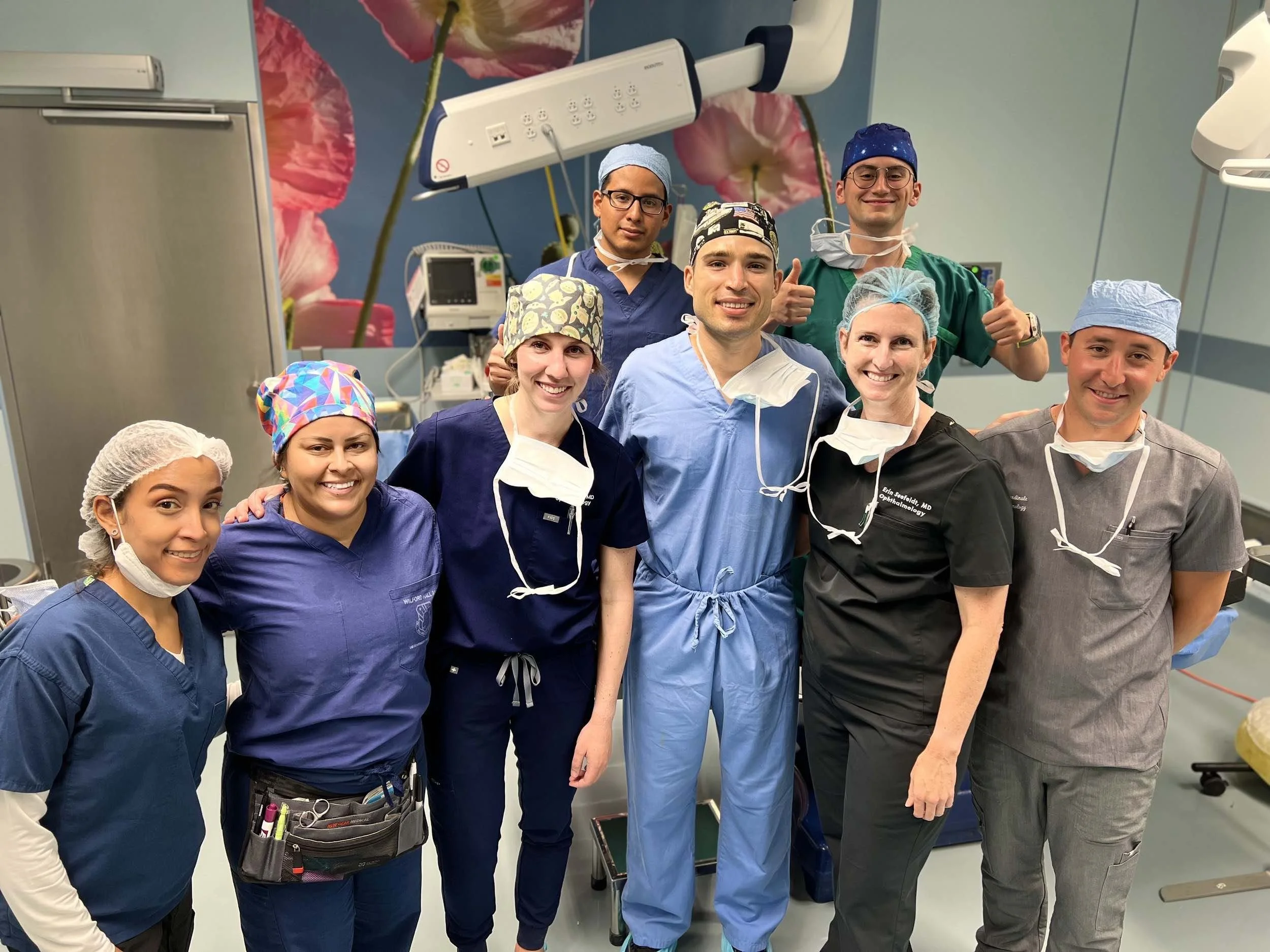 Group photo portraying Dr. Seefeldt with her team while performing an eye surgery.