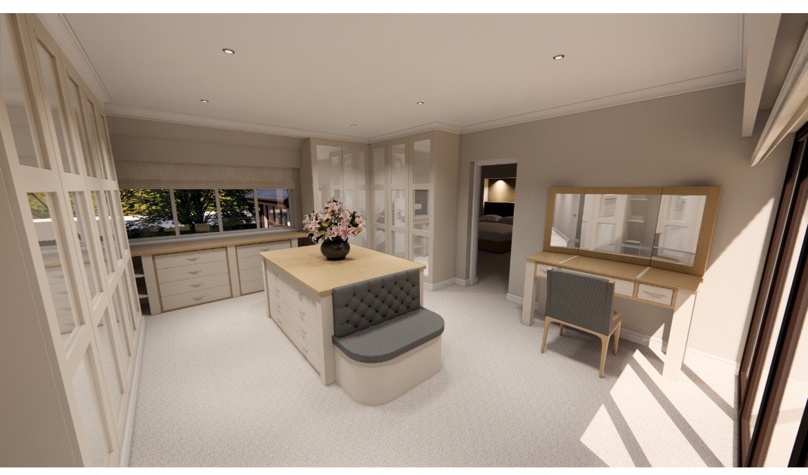 A bright, modern bedroom with a writing desk, large window, and a central island with a flower arrangement.