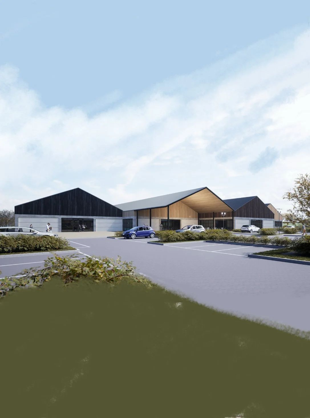 Architectural rendering of a modern clubhouse or community center with multiple gabled roofs, a large front entrance, and a parking lot with several cars, surrounded by landscaped greenery.