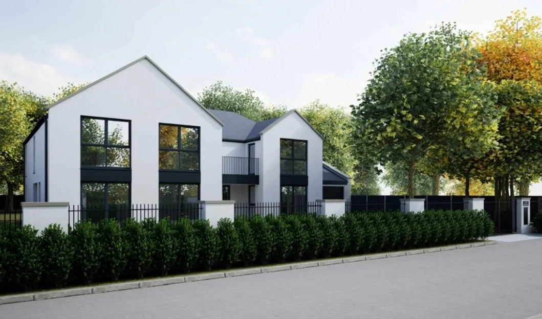 Modern two-story house with large windows, white exterior, black accents, surrounded by trees and a black fence, on a residential street.