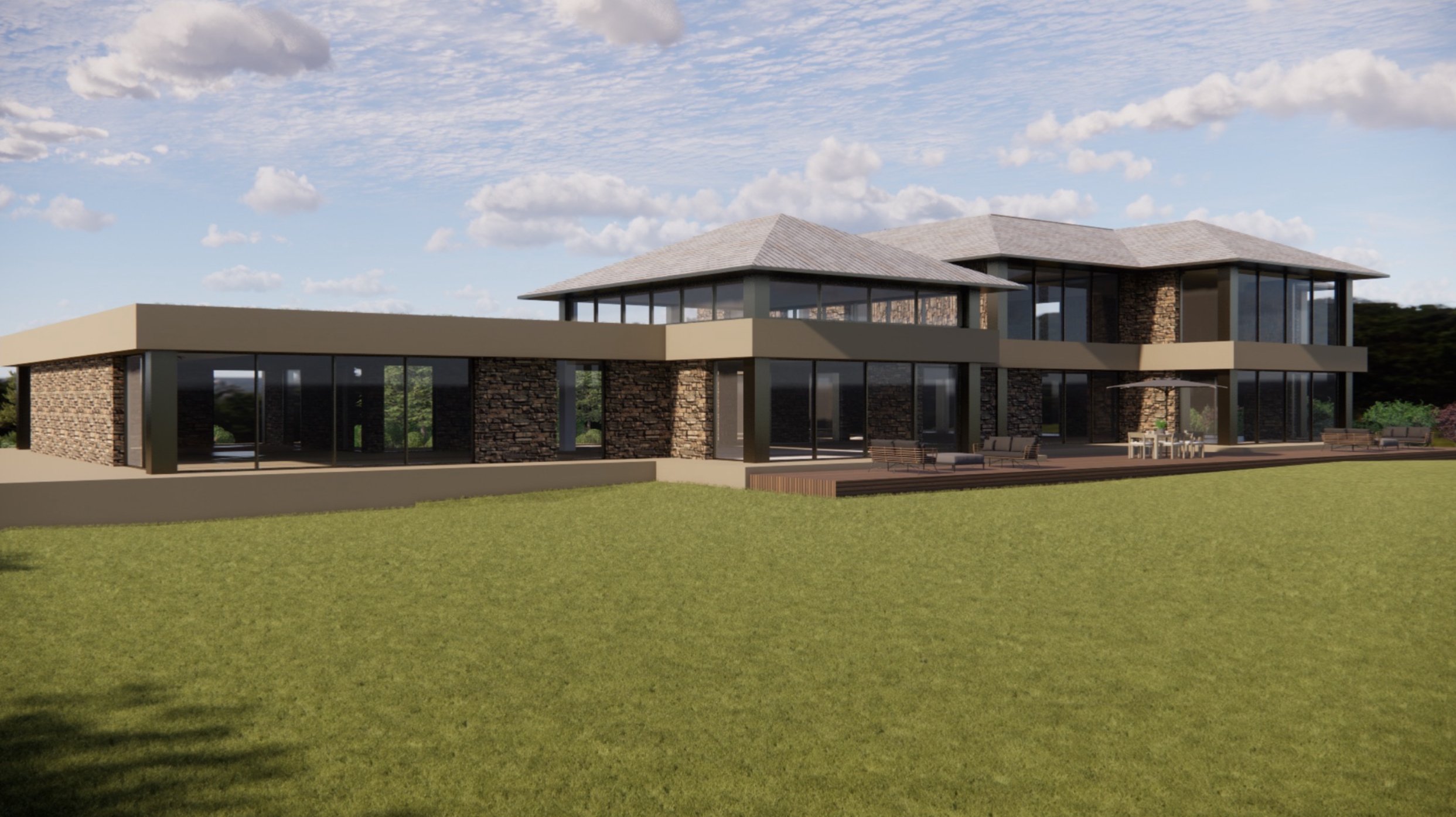 Modern house with glass walls, stone accents, and outdoor seating area under a blue sky with clouds.