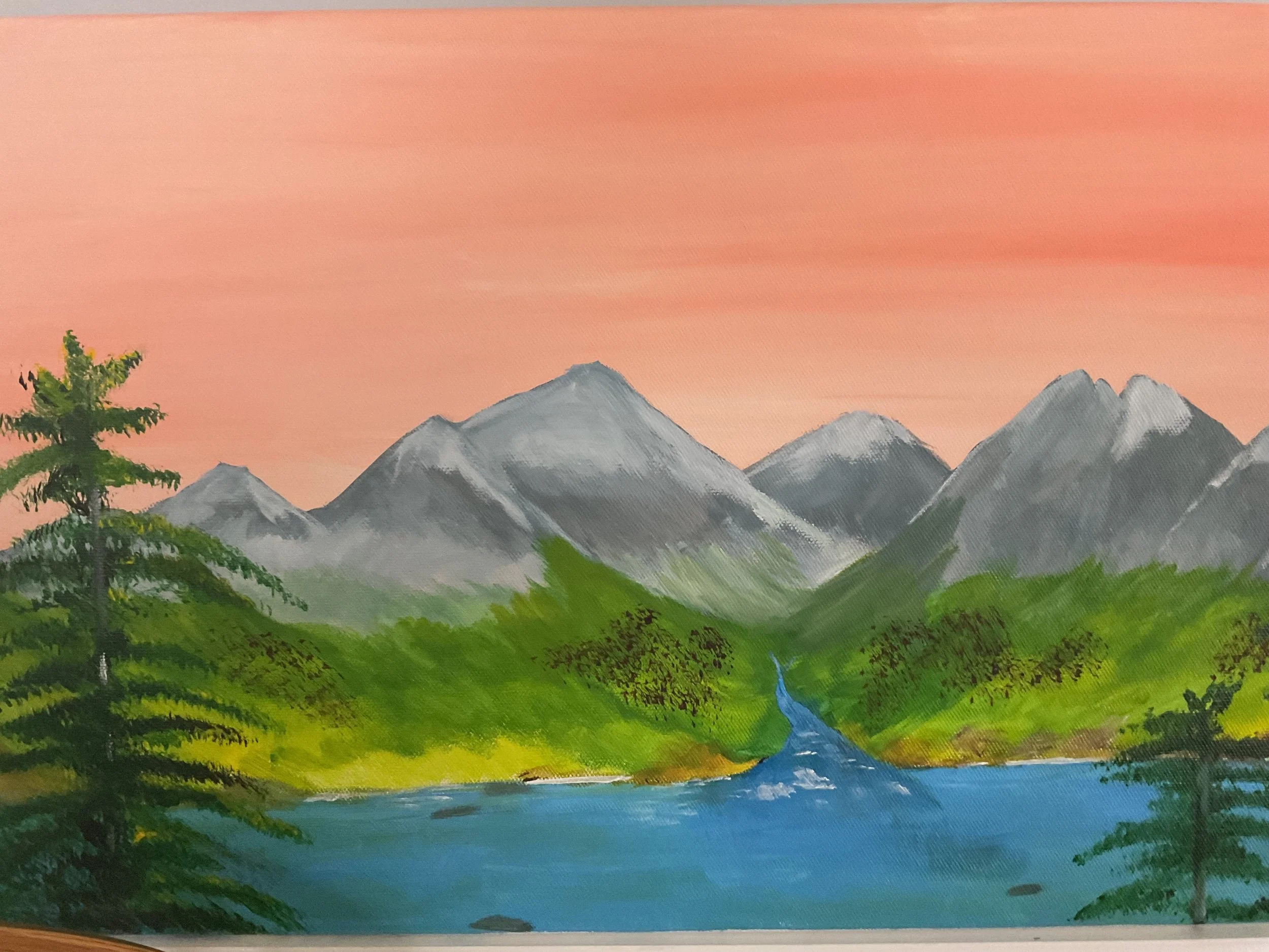 Painting of a mountain landscape with a pink sky, tall snow-capped mountains, green lush trees and bushes, a blue river flowing into a lake with trees on its banks.