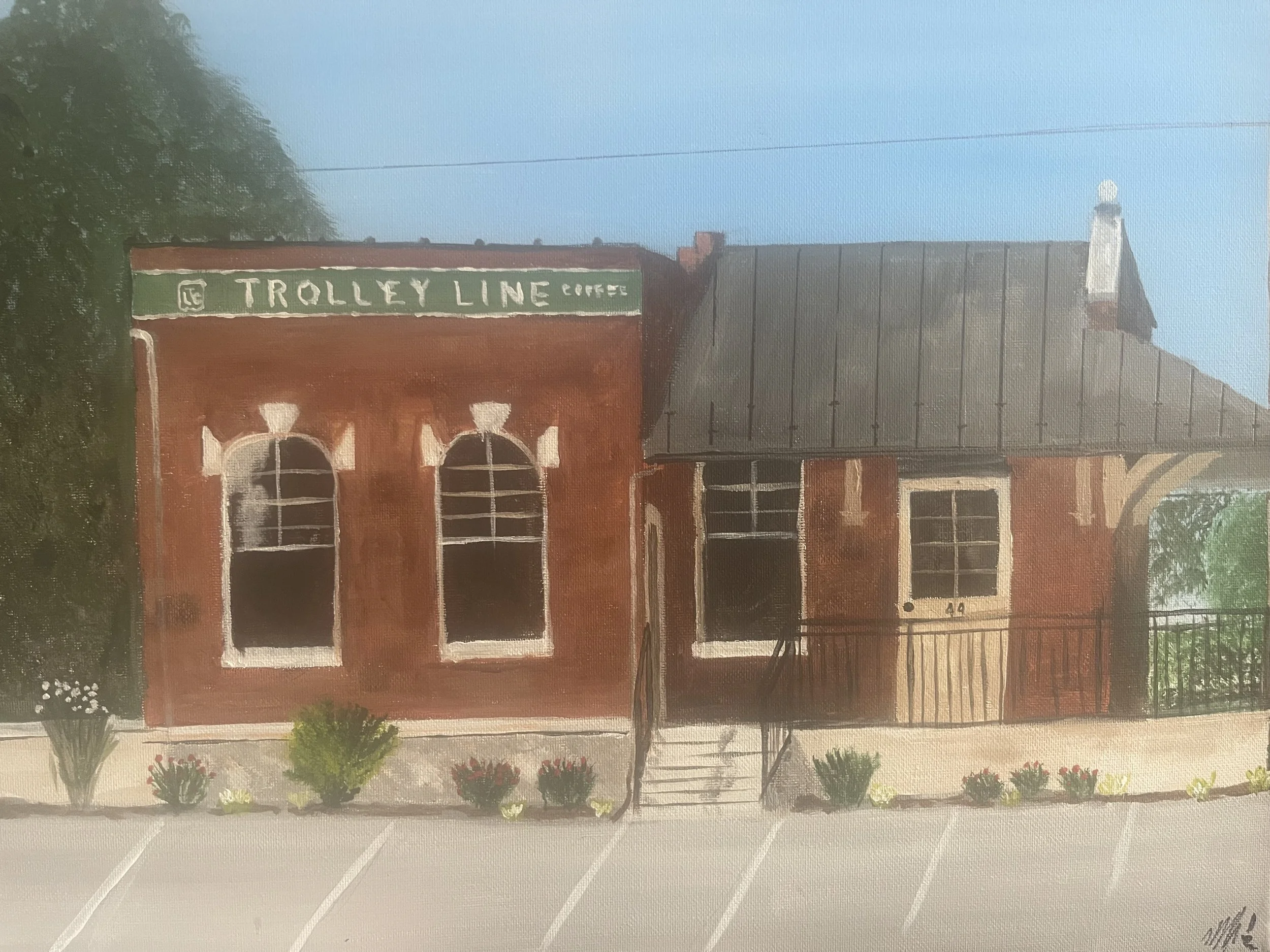 Painting of a small brick train station building with a sign that reads "TROLLEY LINE COFFEE" on a blue sky day, with flower bushes in front and an empty parking lot.