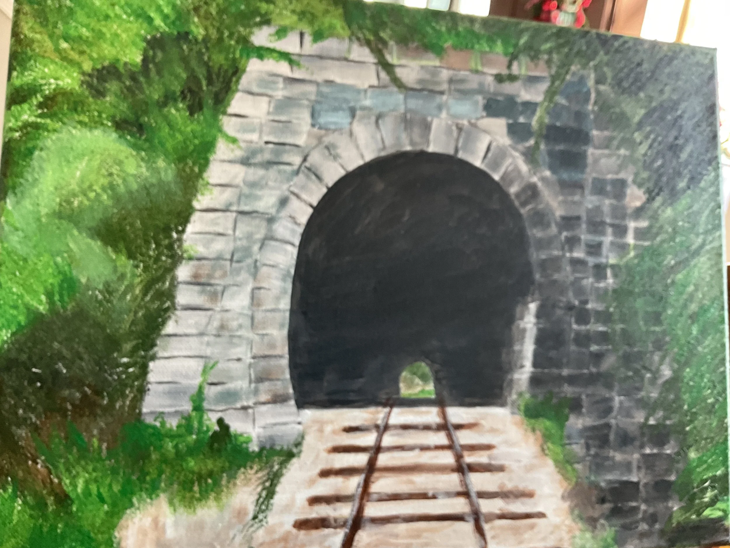Painting of a train tunnel with a brick archway, surrounded by green foliage, with train tracks leading into the dark tunnel.