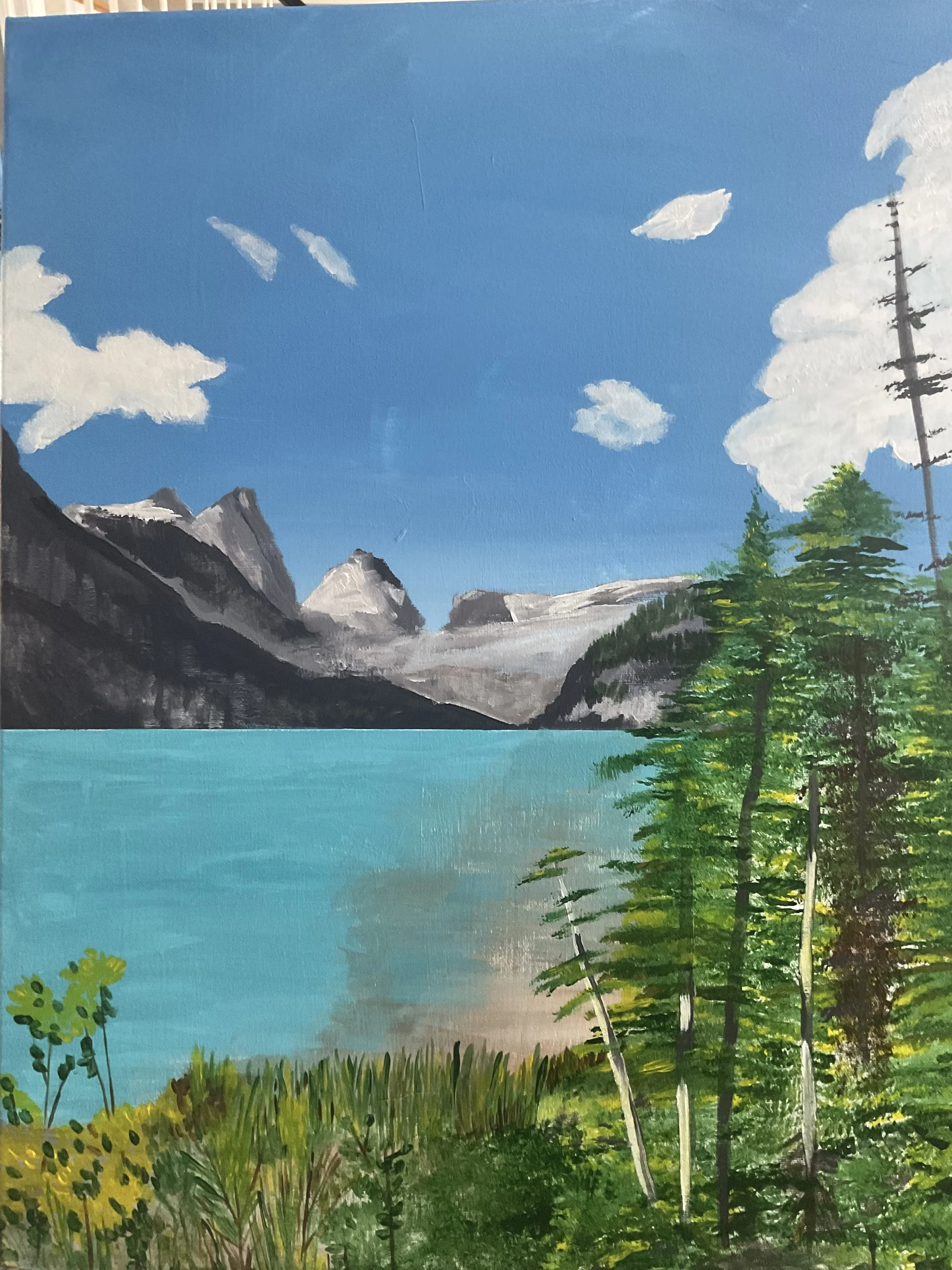 A landscape painting of a lake surrounded by mountains, with trees in the foreground and a bright blue sky with clouds.