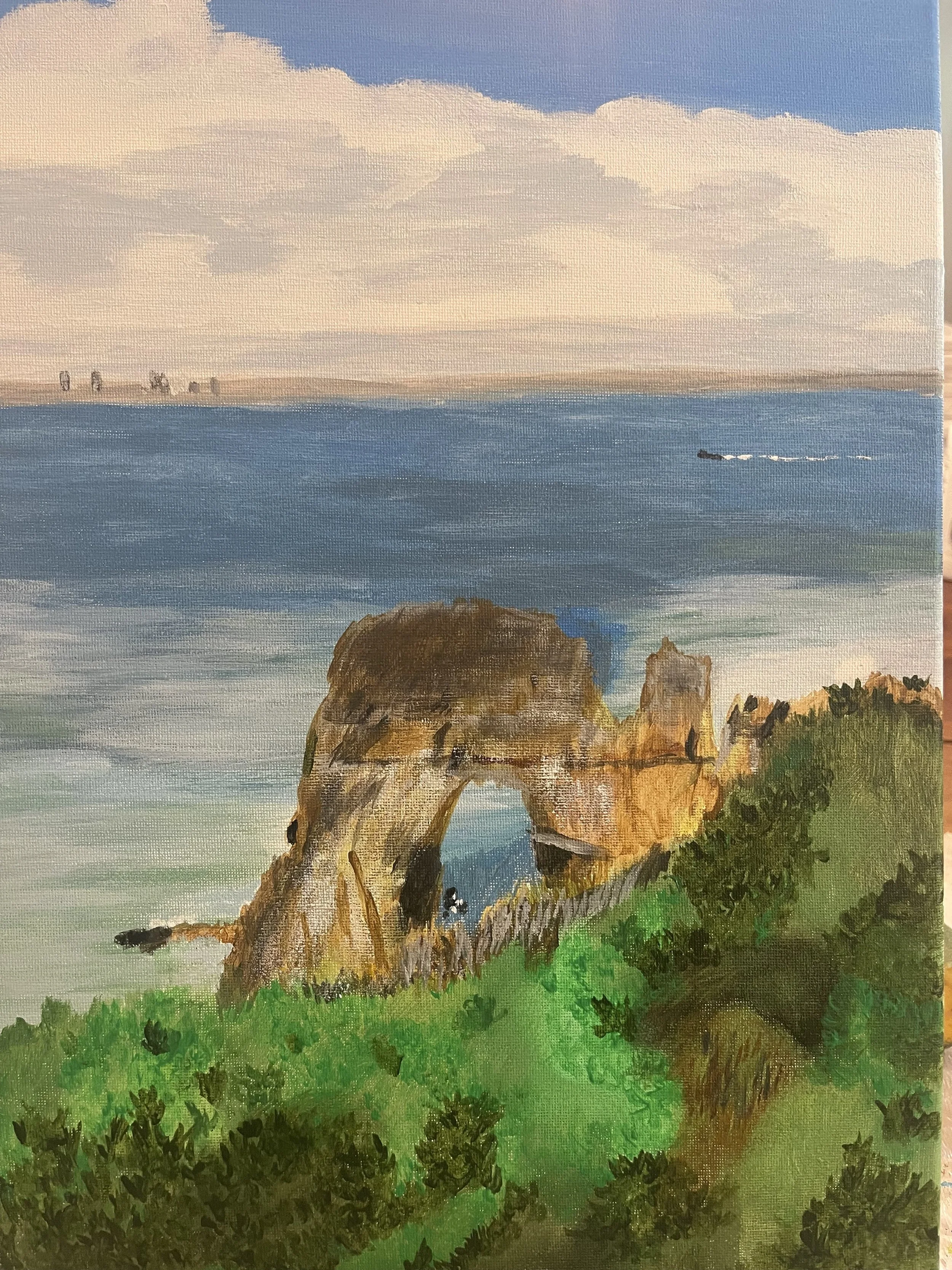 A landscape painting of a coastal scene with green foliage in the foreground, rocky arches and cliffs, and a blue ocean extending to the horizon under a partly cloudy sky.