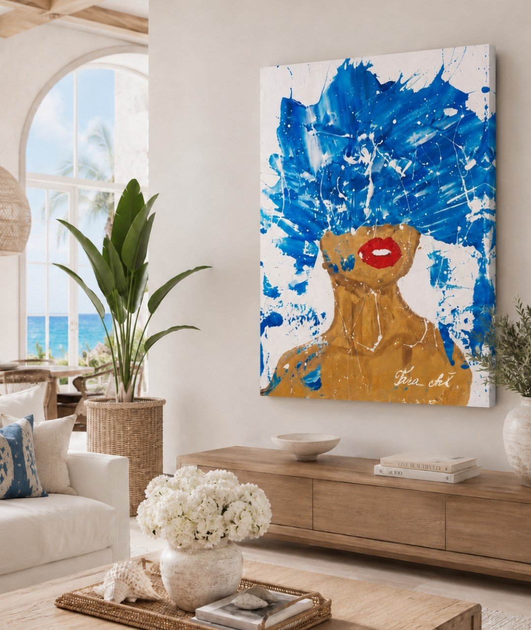 “Ocean Muse” by Tarana Sumer, a large abstract portrait featuring a woman with vivid blue hair and red lips, displayed in a modern neutral-toned living room.
