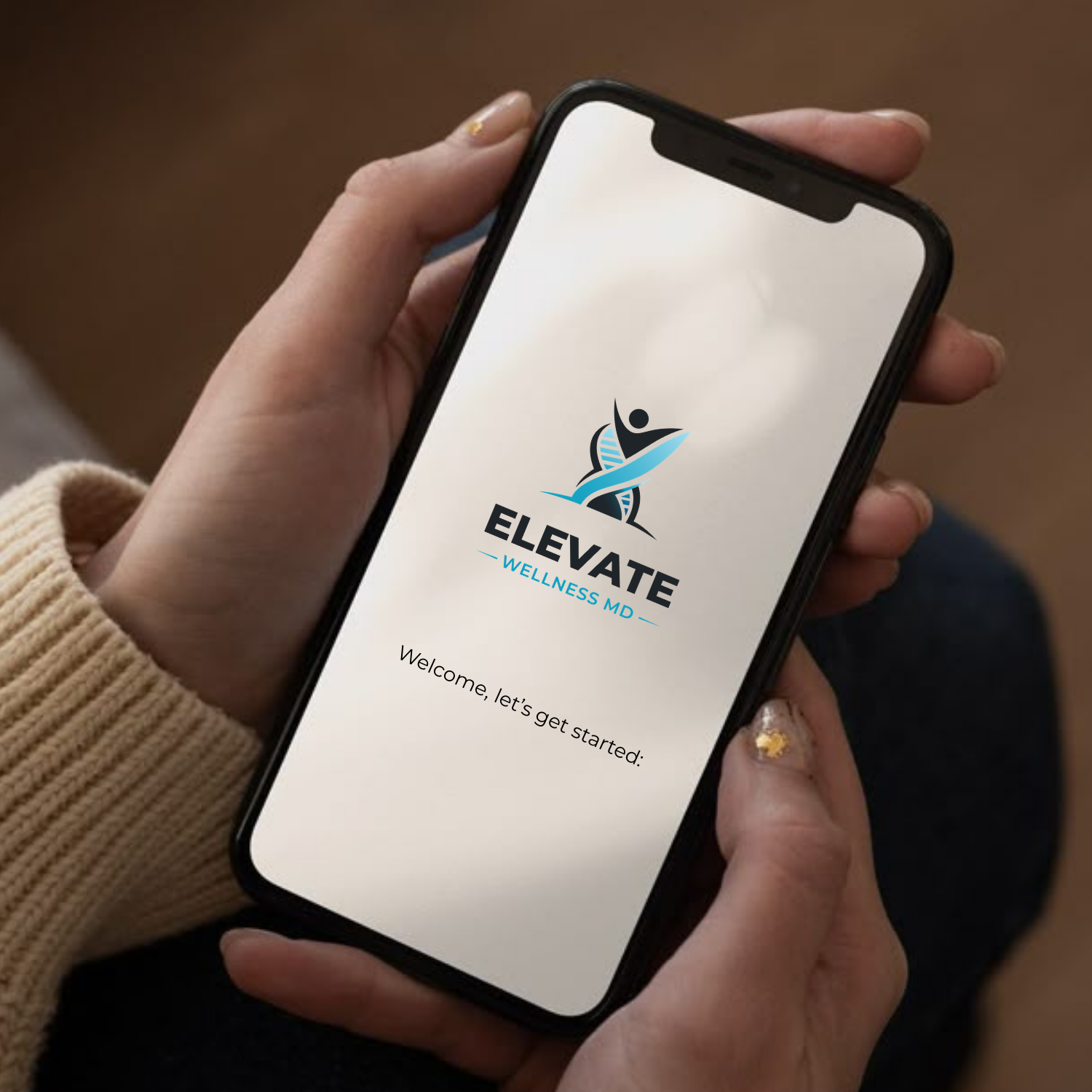 A person holding a smartphone displaying the Elevate Wellness MD app logo and welcome message.