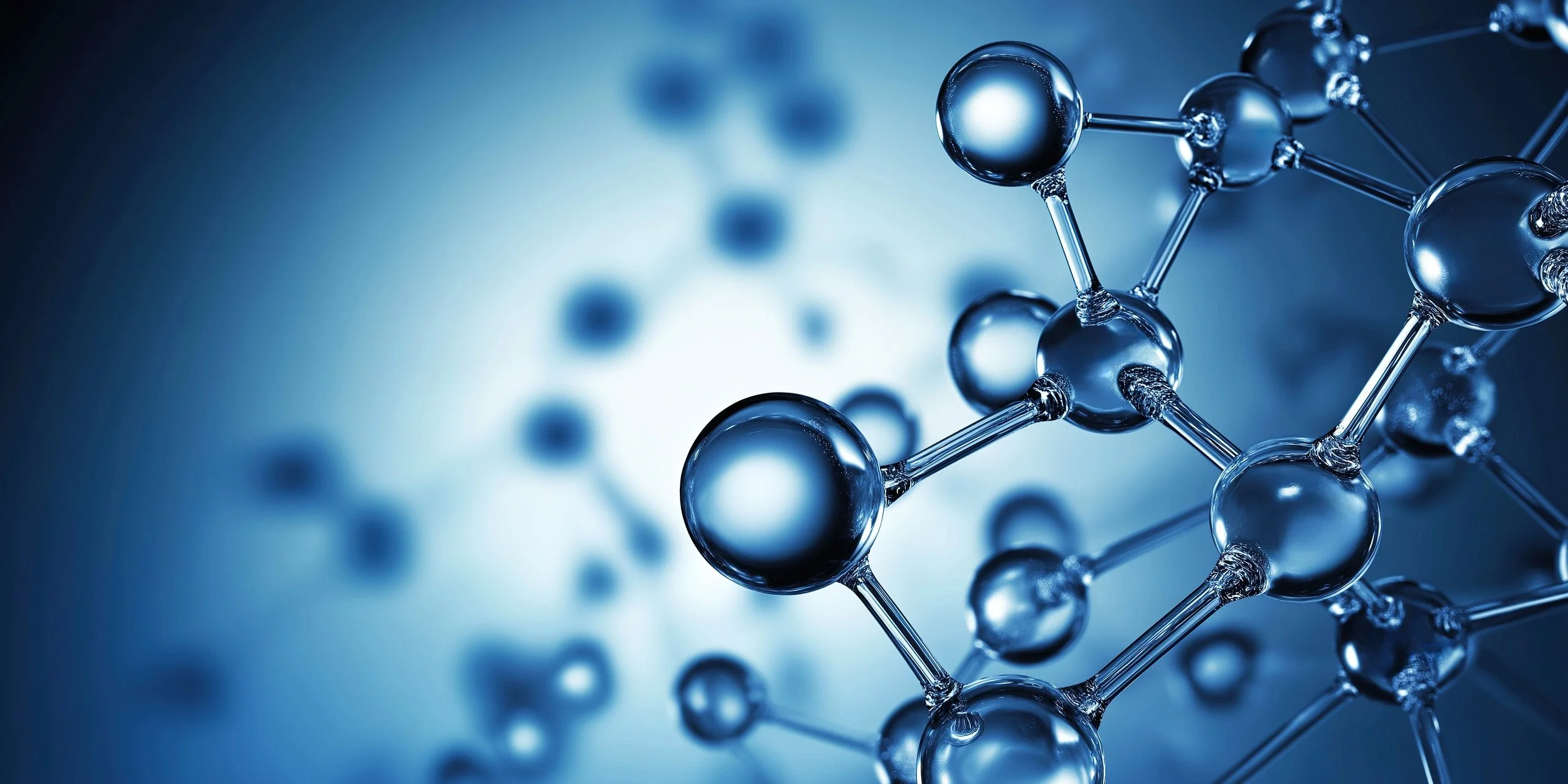 A close-up of a molecular structure with interconnected spheres and sticks, depicted in metallic blue tones, against a blurred background.