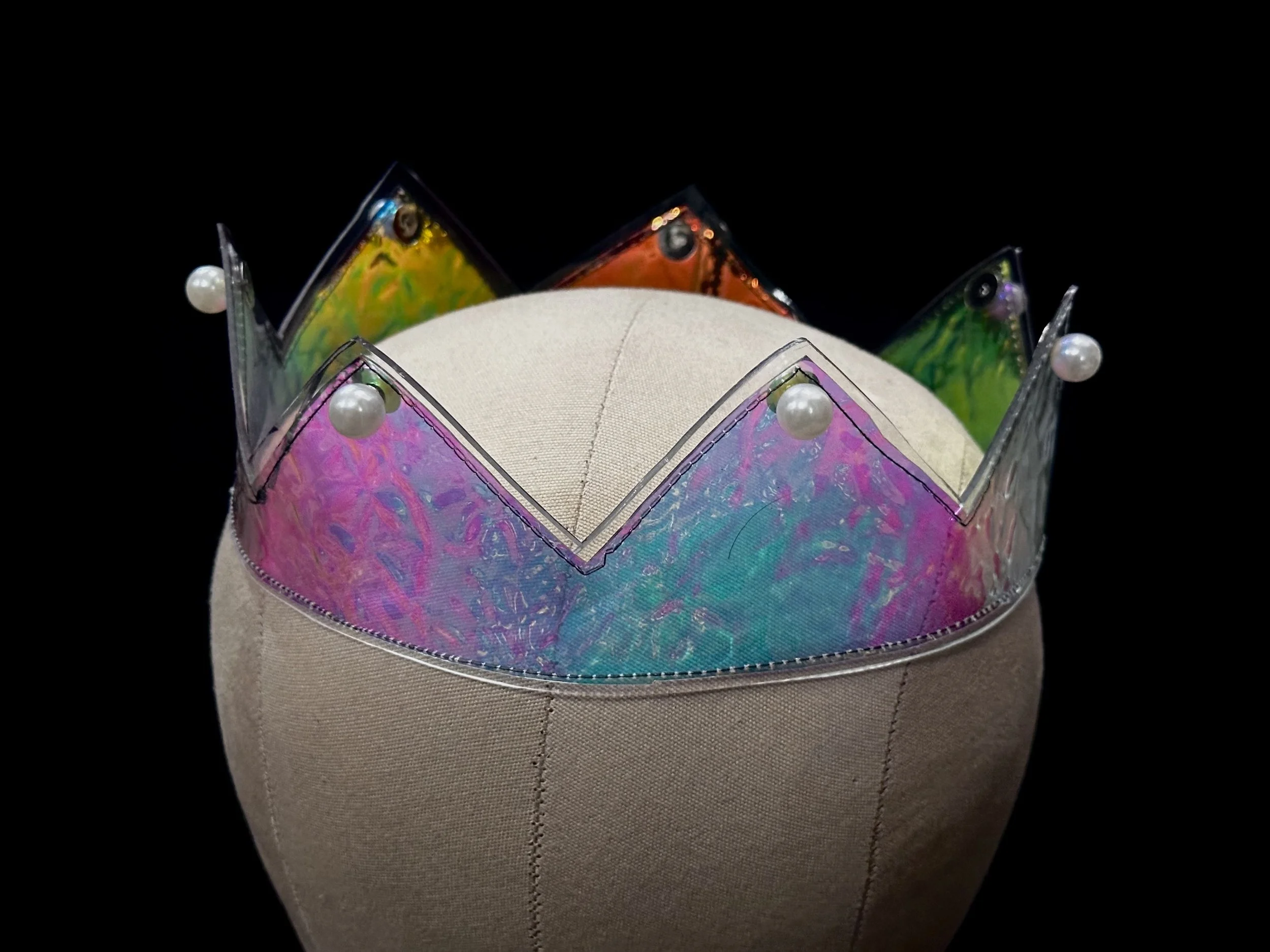 holographic blue rainbow pearl stud crown with black stitching