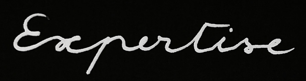 Mot en cursive blanc sur fond noir.
