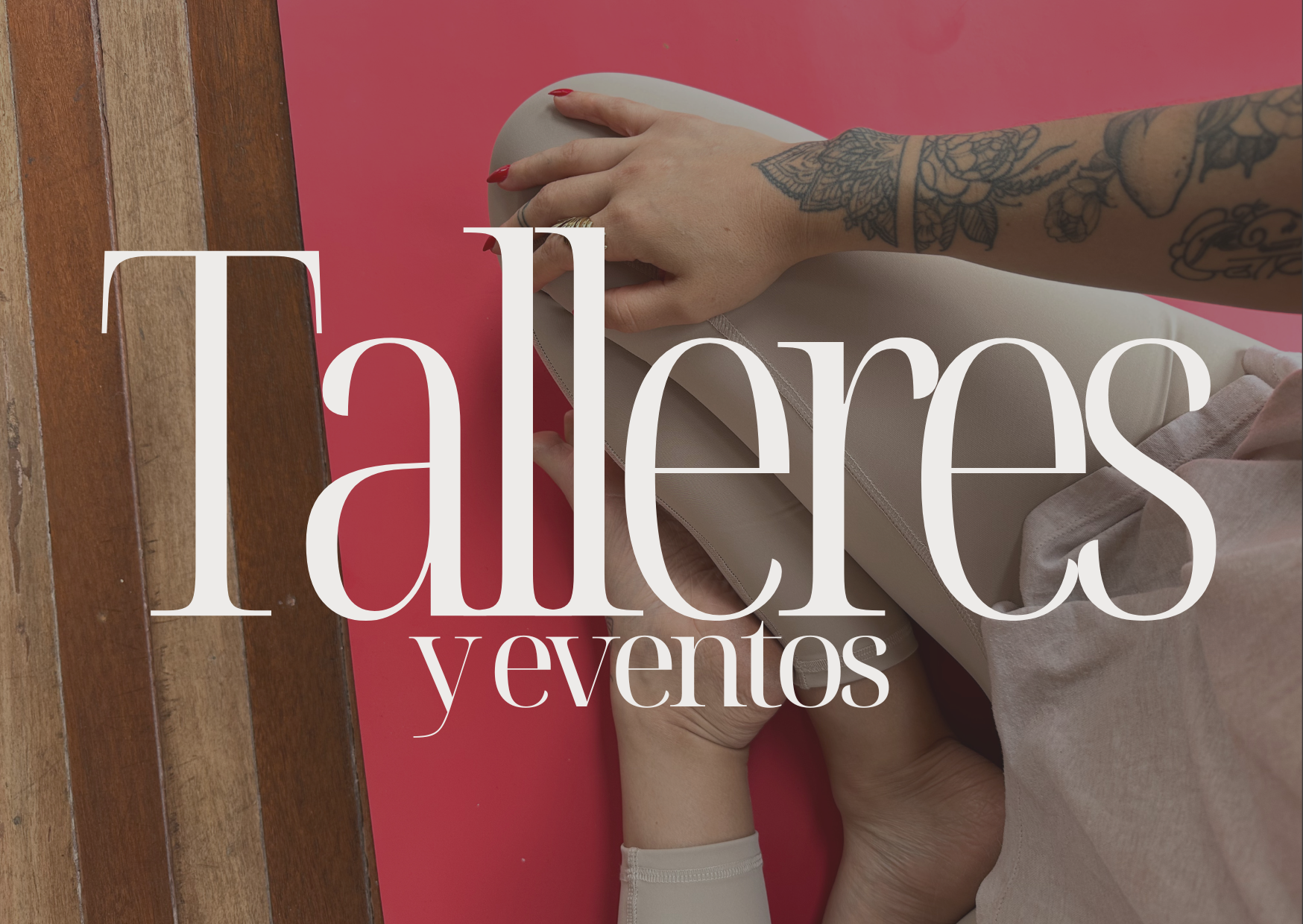 A person with tattoos on their arm working on a laptop at a wooden table with a pink background, overlaid with the text 'Talleres y eventos' in large white font.