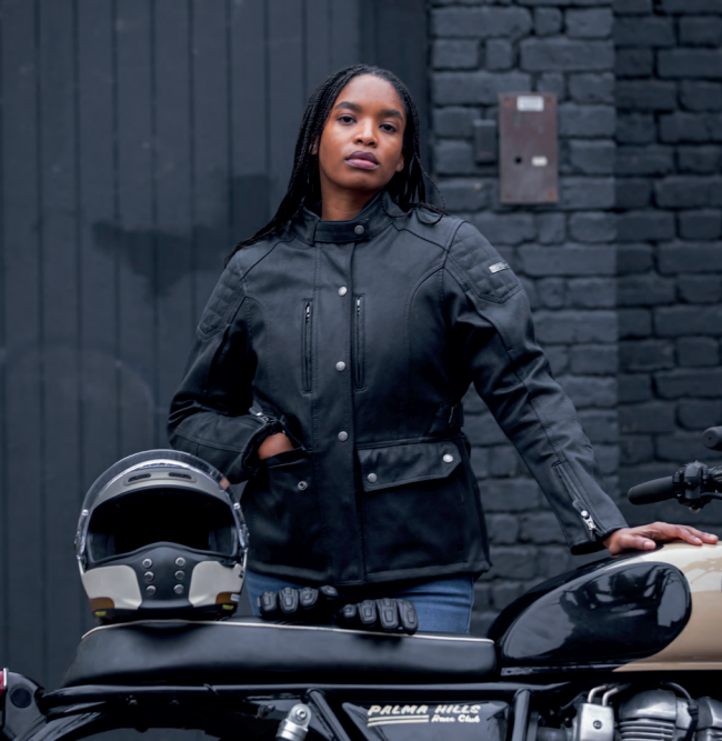 Photo of a lady wearing a black Oxford jacket