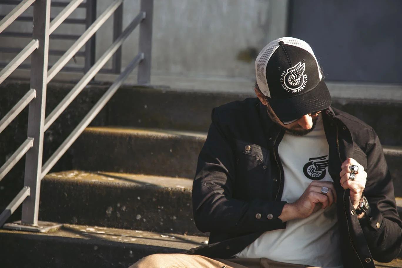 Photo of a man wearing Age of Glory clothing and cap