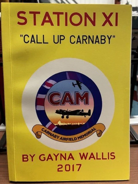 A photo of the book cover for 'Station XI: Call Up Carnaby' by Gayna Wallis 2017