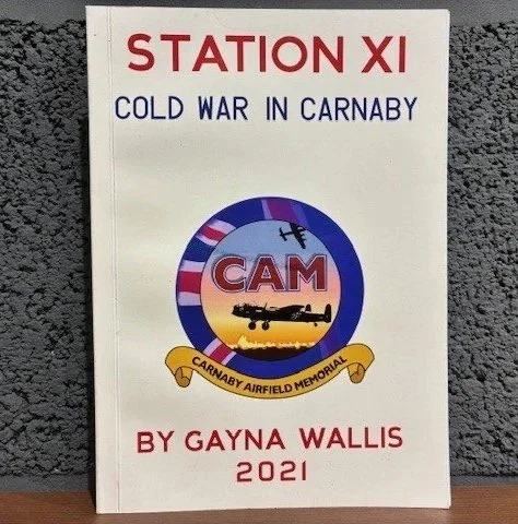 A photo of the book cover for 'Station XI: Cold War in Carnaby' by Gayna Wallis 2021