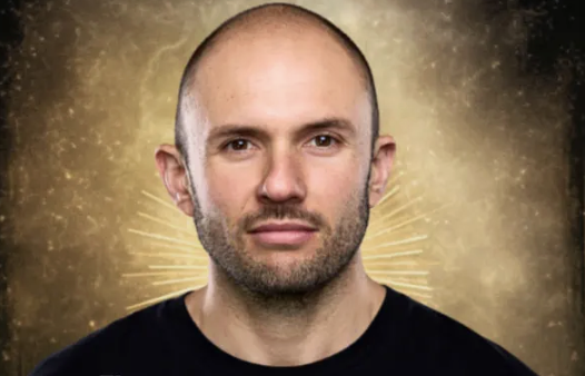 Chris Geisler— men's coach and group facilitator, headshot with a warm golden radiant background — review of Catherine Hale's coaching.