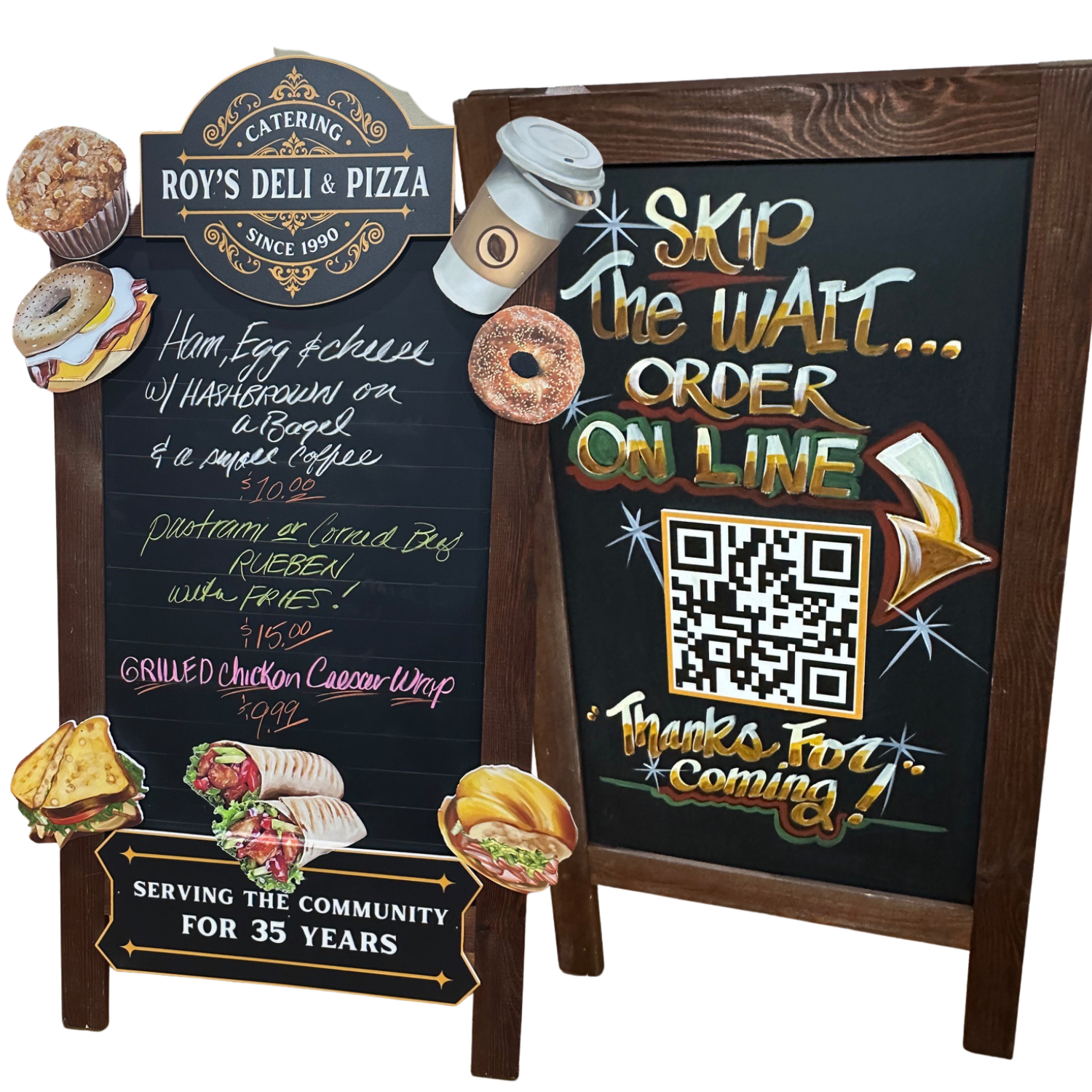 Two chalkboard signs advertising Roy's Deli & Pizza with colorful drawings of food items and a QR code, promoting online ordering and highlighting menu items.