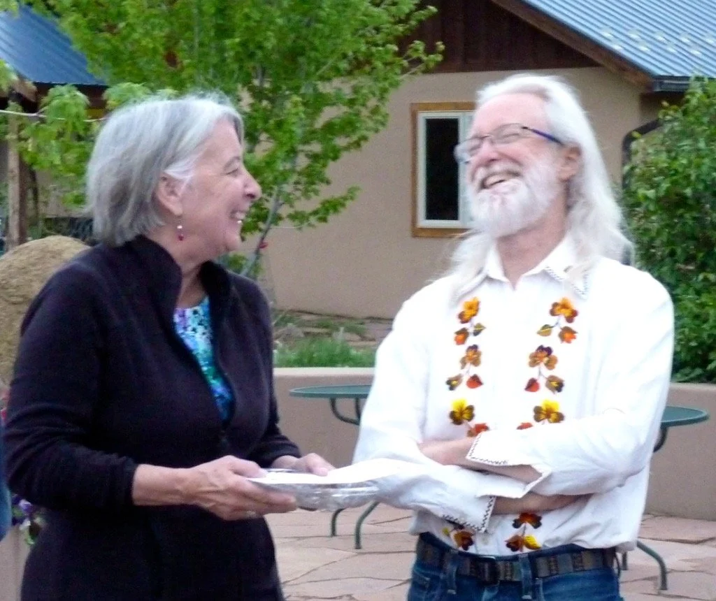 Julie and Scott sharing a laugh on the common house terrace.