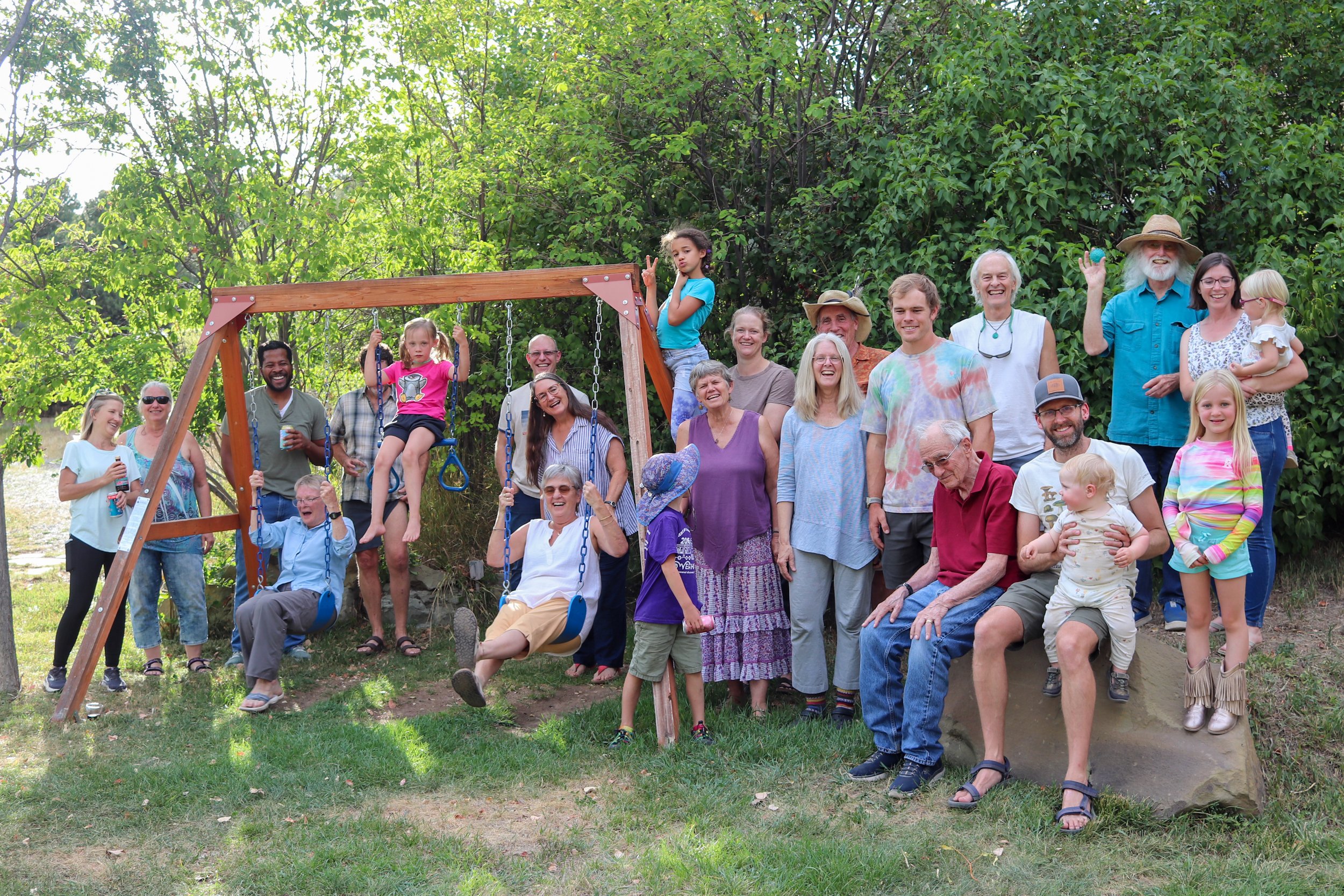 Group  of people all togehter smiling at the camera.