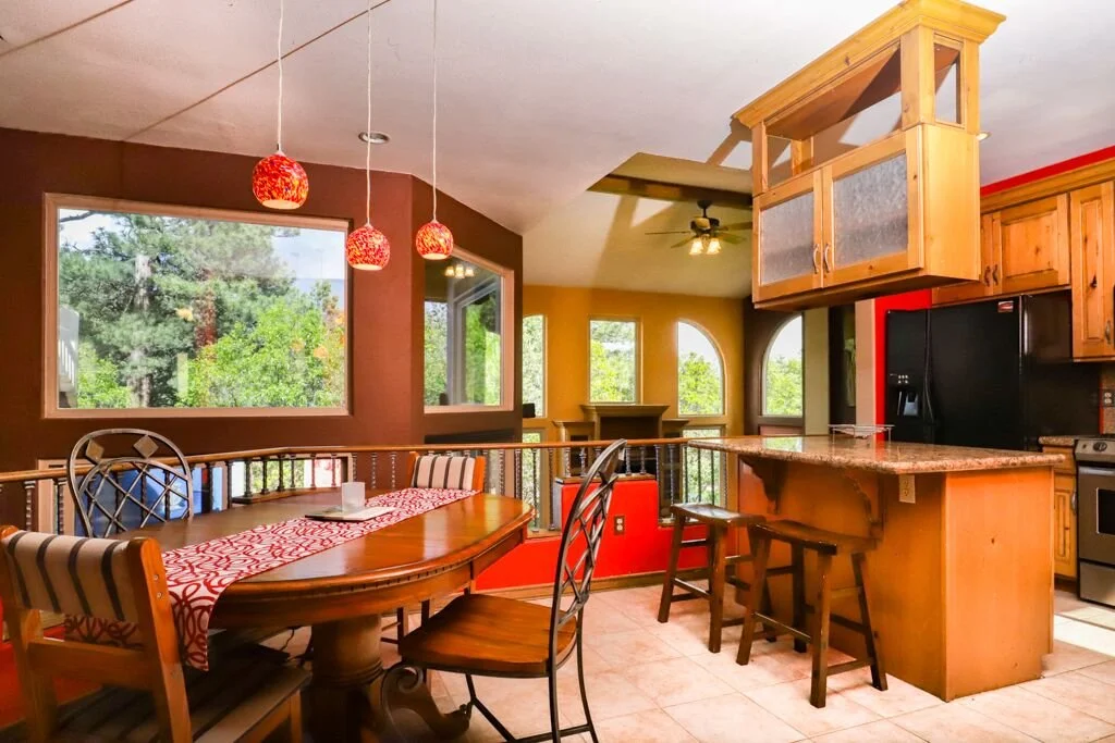 Dining room and kitchen in home #21.