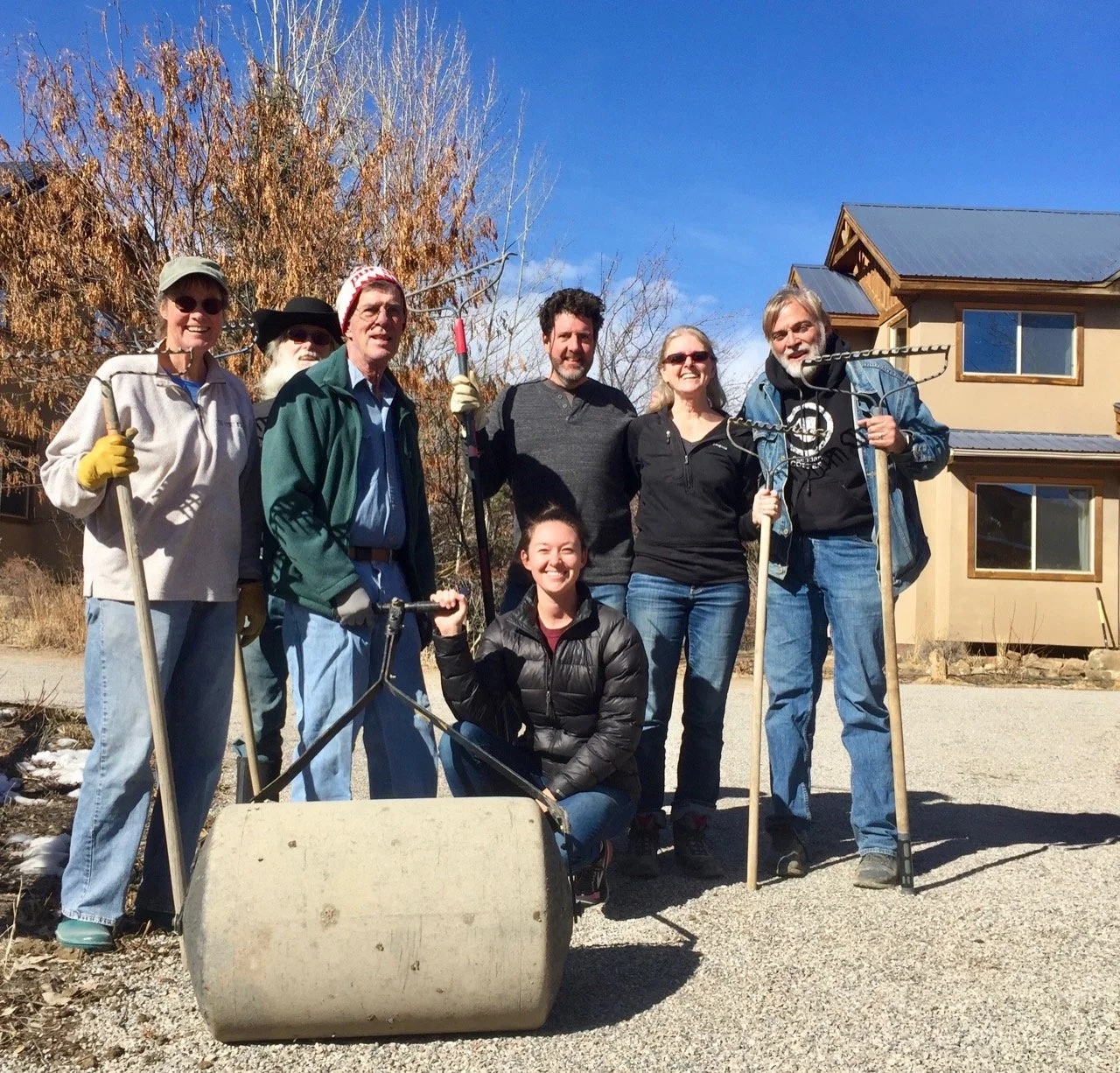 Putting down fresh gravel on the pedestrian pathways.