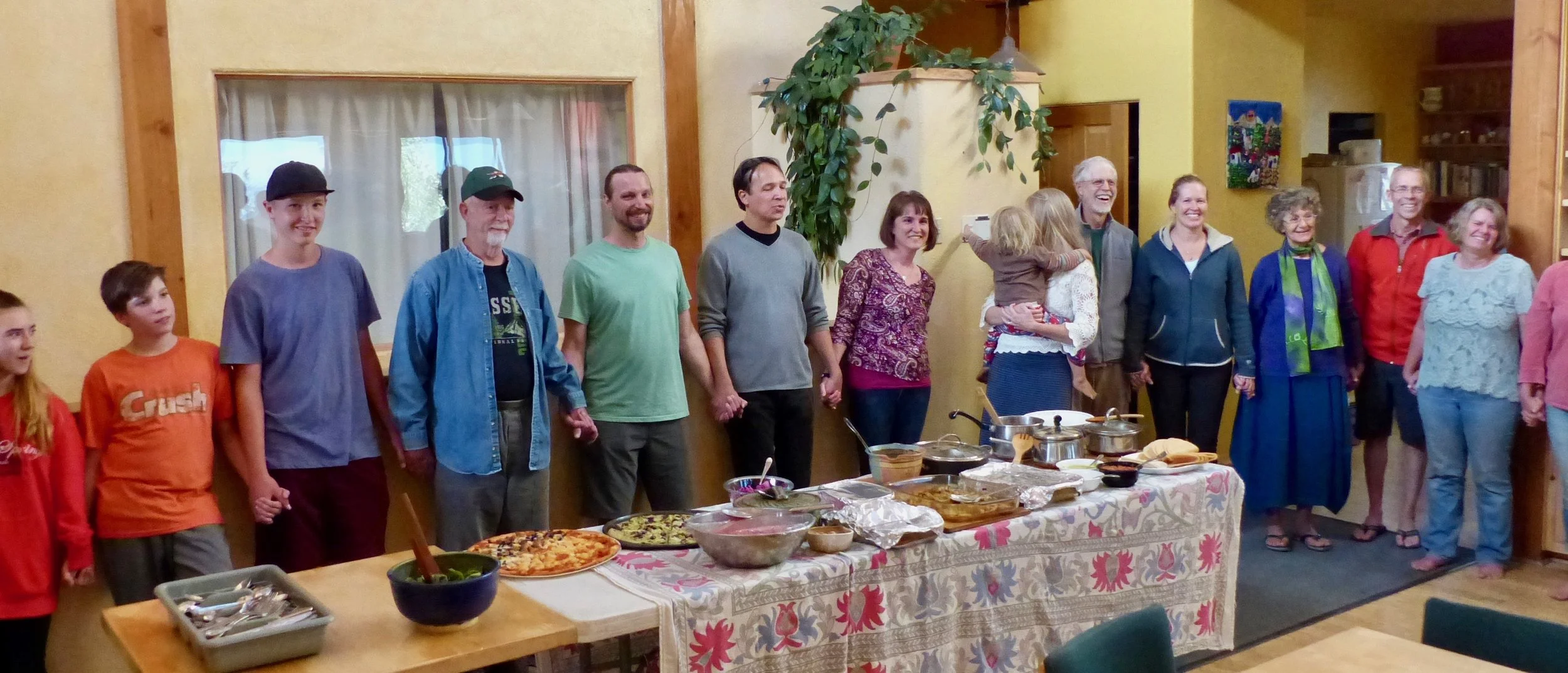 Circling up before a community dinner in the common house.