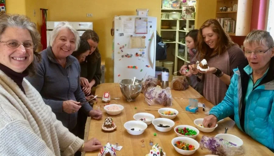 Decorating gingerbread houses for the holidays.