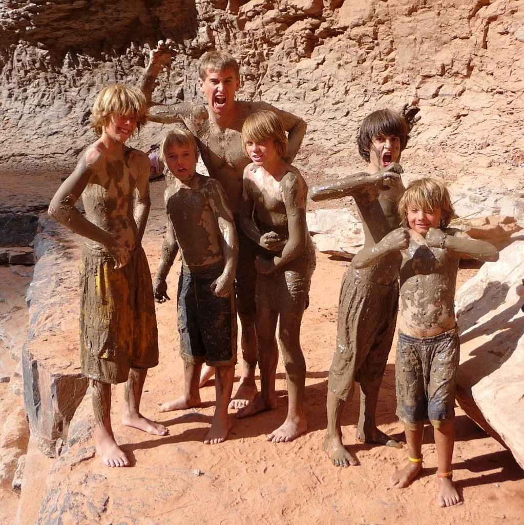 Boys getting crazy with mud on the San Juan River.