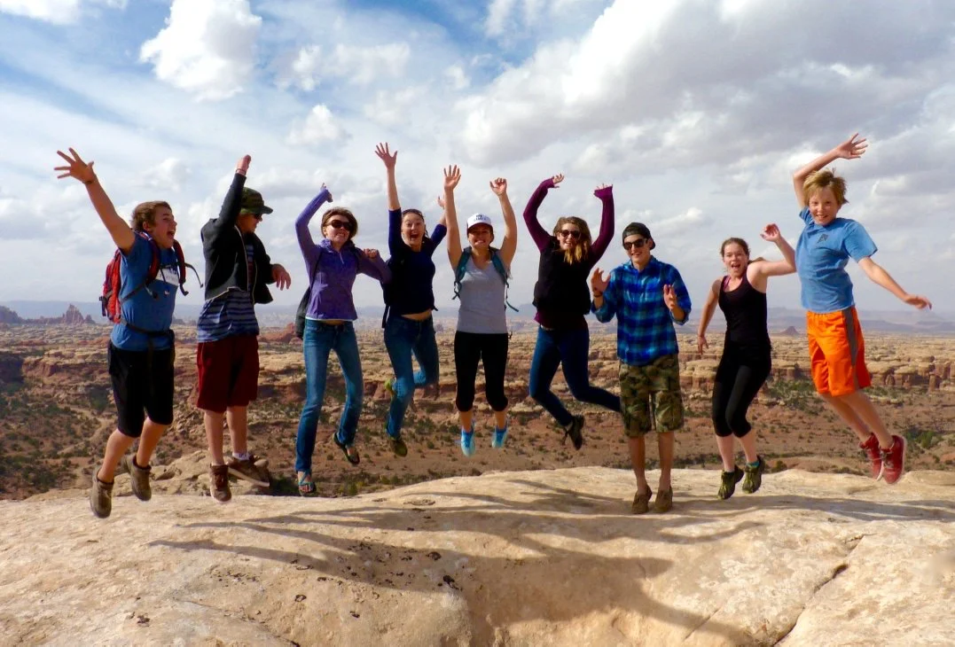 Teenagers getting crazy on a hike in Canyonlands.