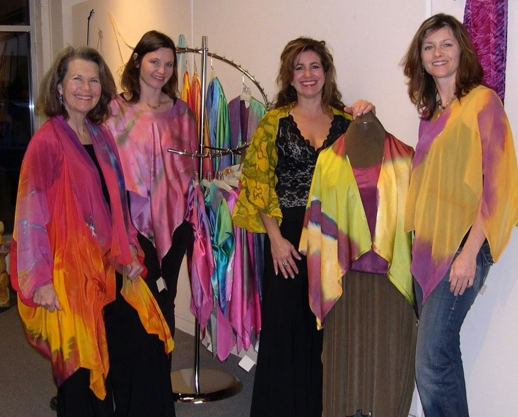 Showing off their fiber arts creations.