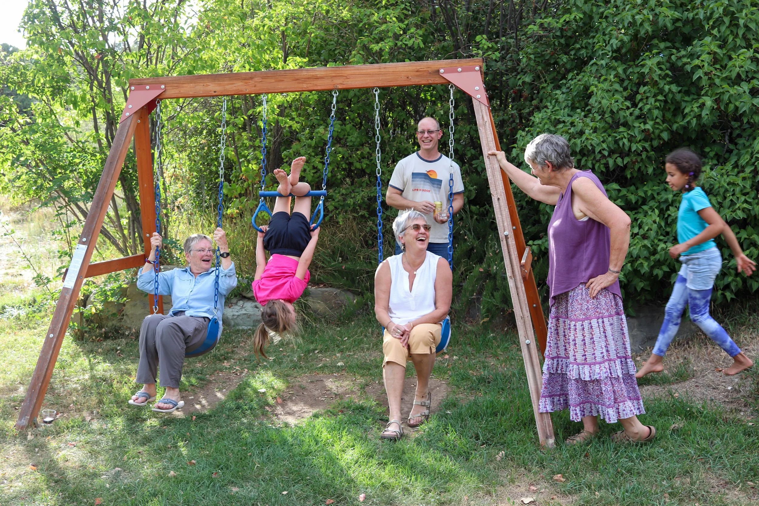 Kids and adults playing together. 