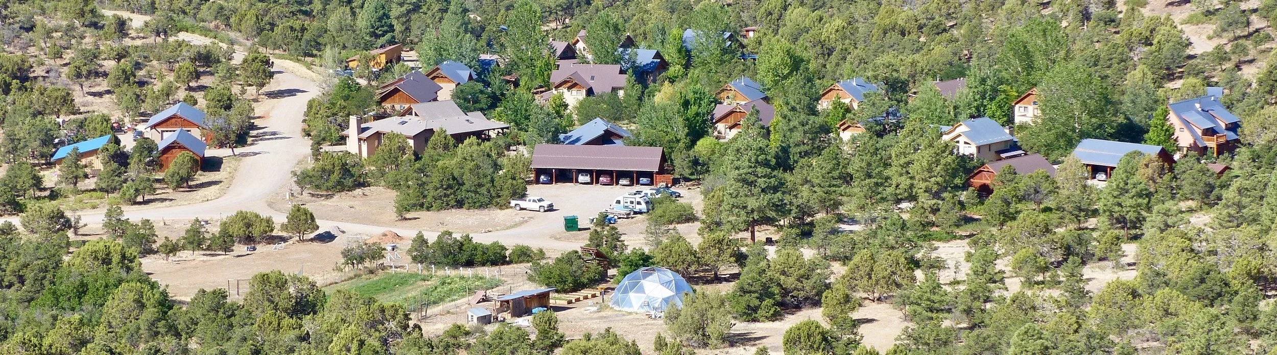 We are blessed with forests, irrigated pasturelands, and 7 miles of trails on our 360 acres. By clustering our homes, we've preserved 350 acres of open space. Our new Phase 2 homes are being built in the foreground of this photo.