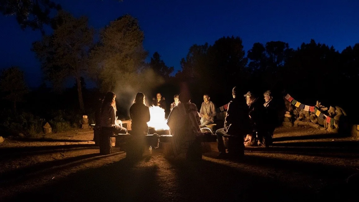 Sitting with the fire under a brilliant starry sky.