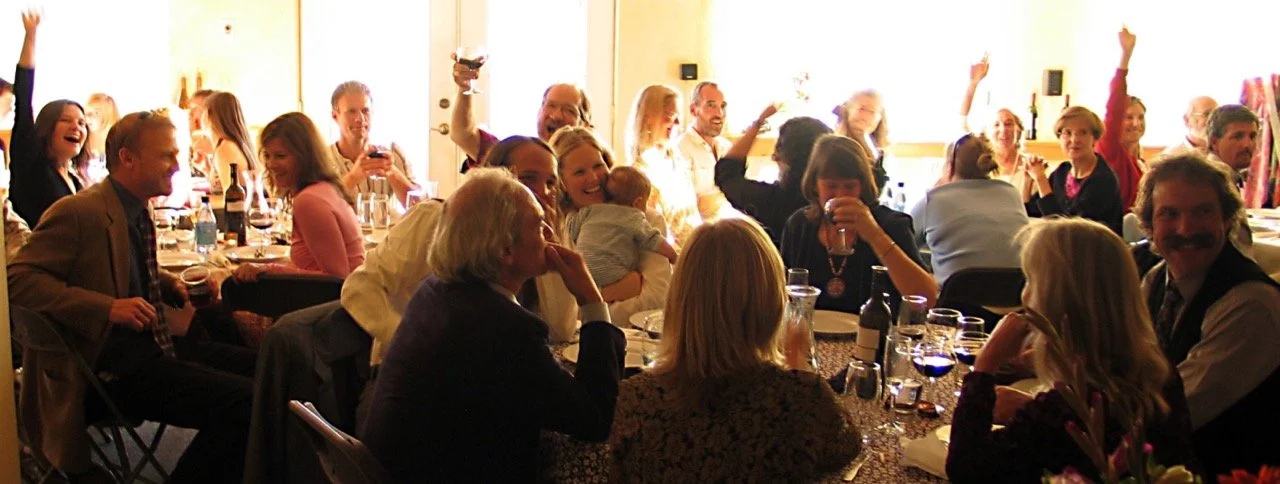 Toasting the bride and groom in the common house dining room.