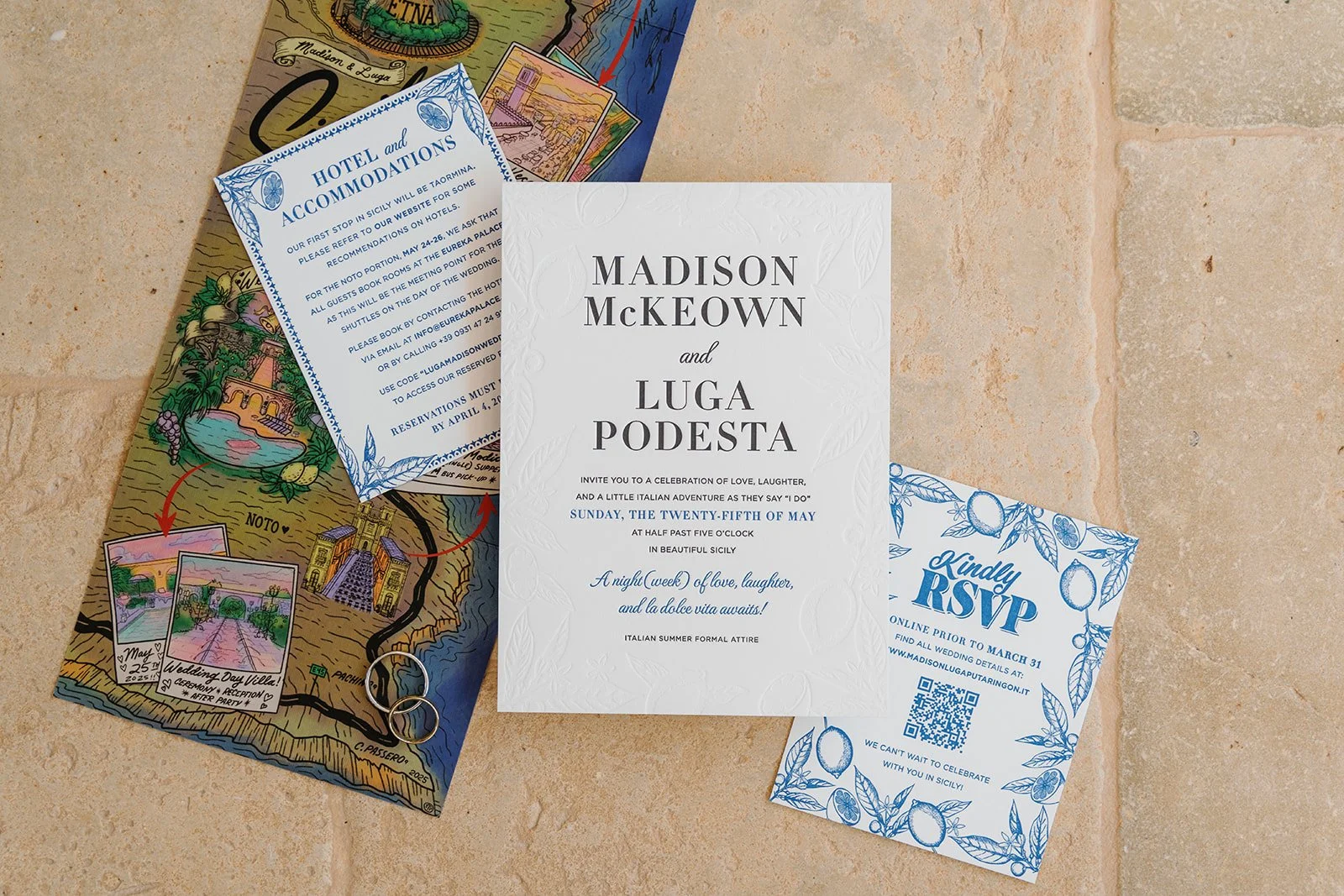 Wedding invitation suite including a main card with the names Madison McKeown and Luga Podesta, giving details of the celebration in Sicily on May 25th, a RSVP card with a blue lemon design, and a hotel accommodation card with a blue border with illu