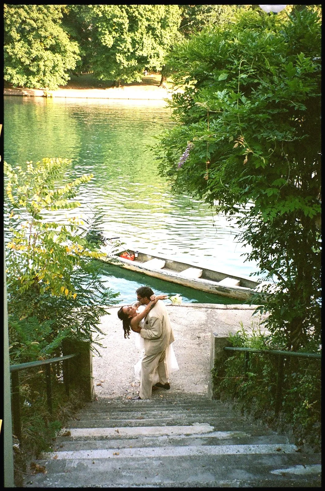couple kissing stairs river turin italy wedding