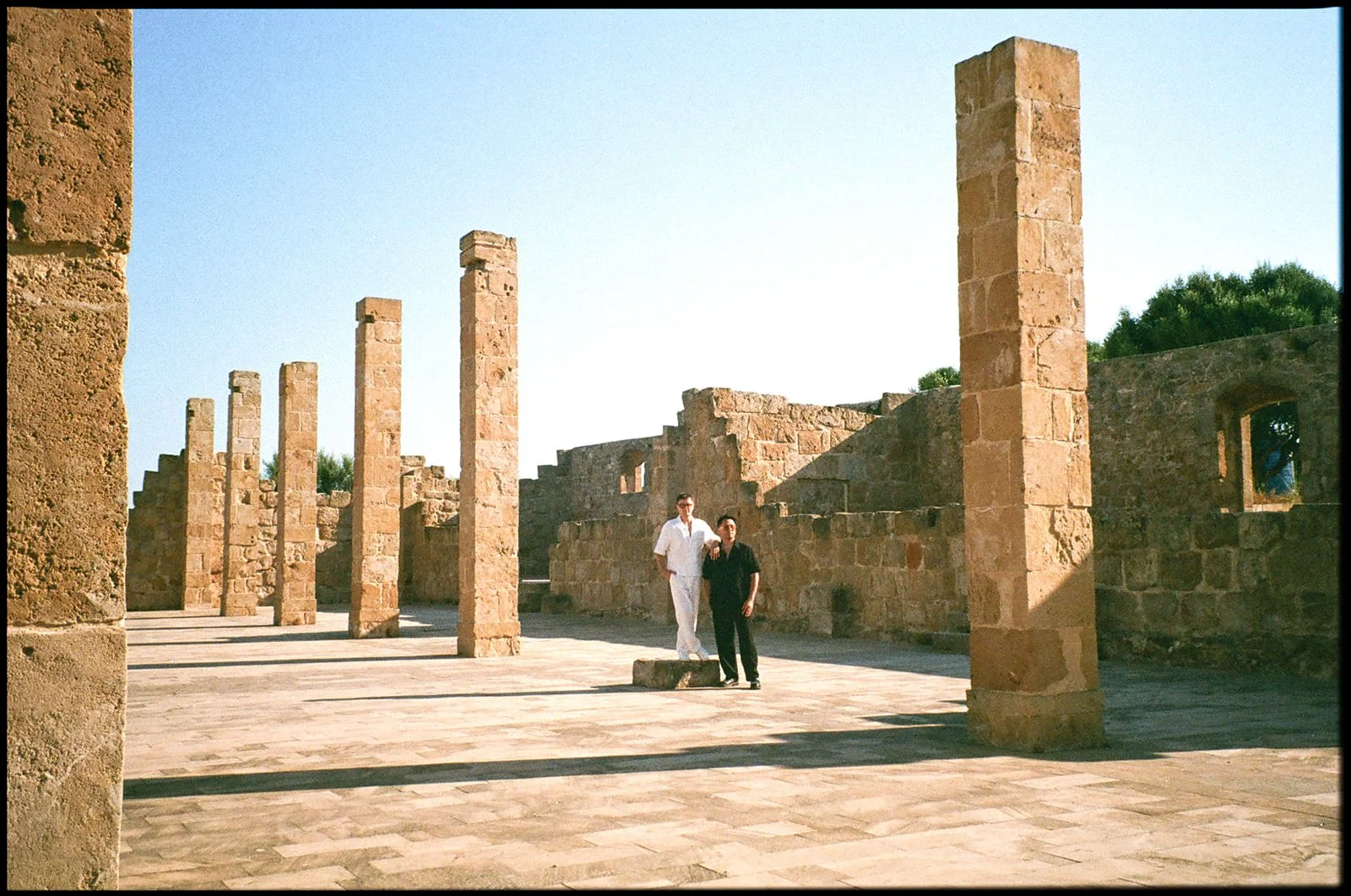 couple walking tonnara di vendicari sicily engagement shoot
