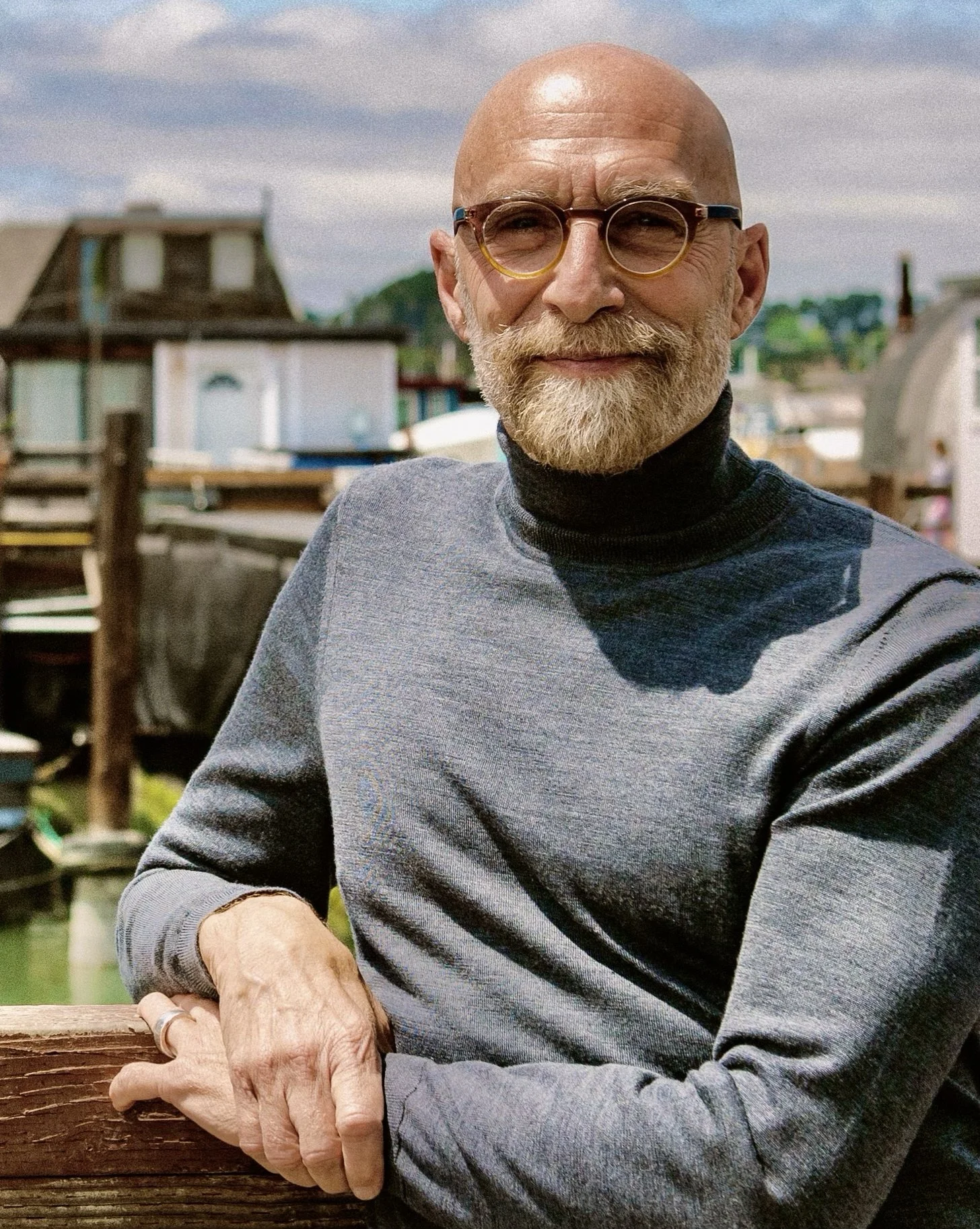 David standing at the dock of his floating home.