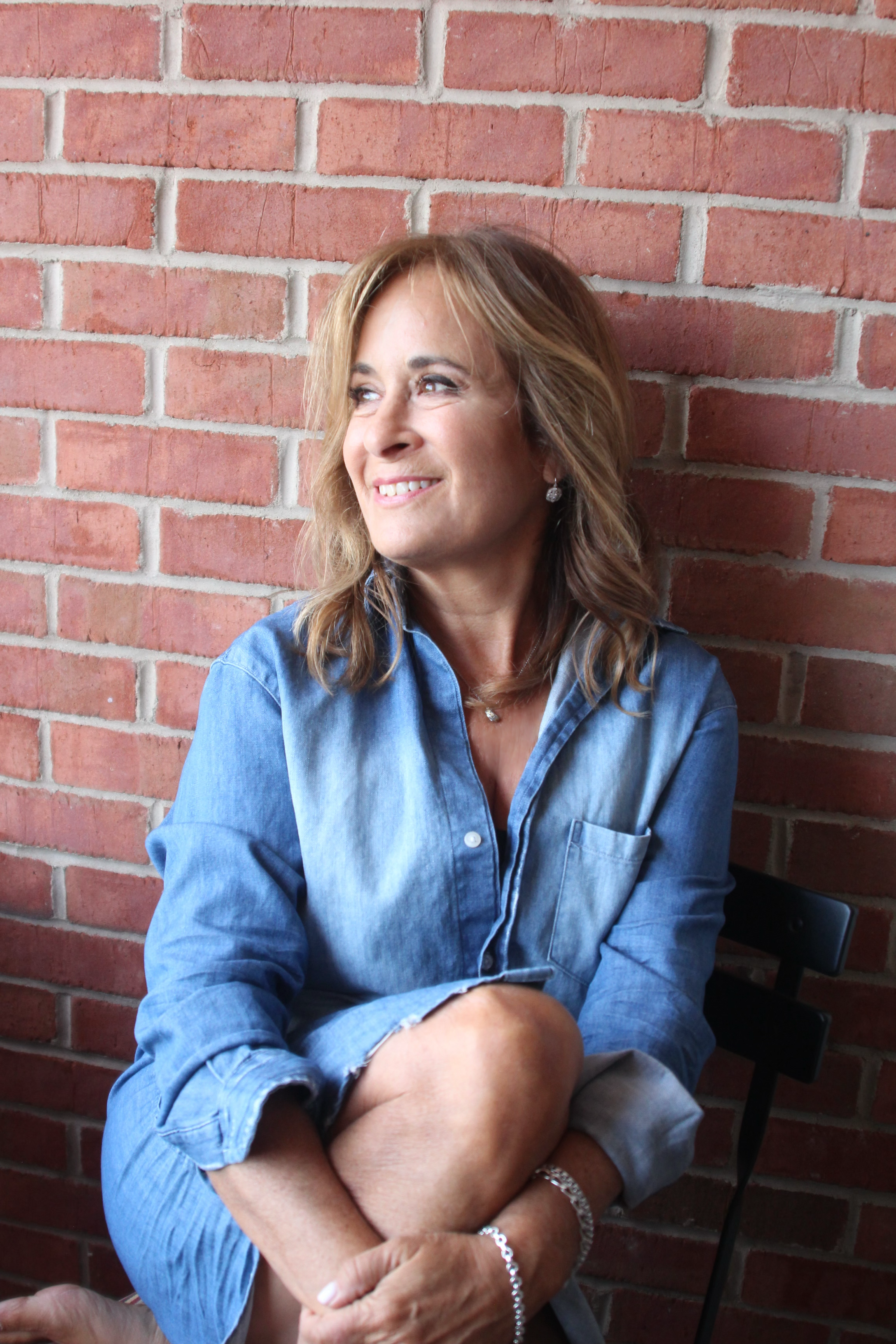 brick wall blue shirt edited.png