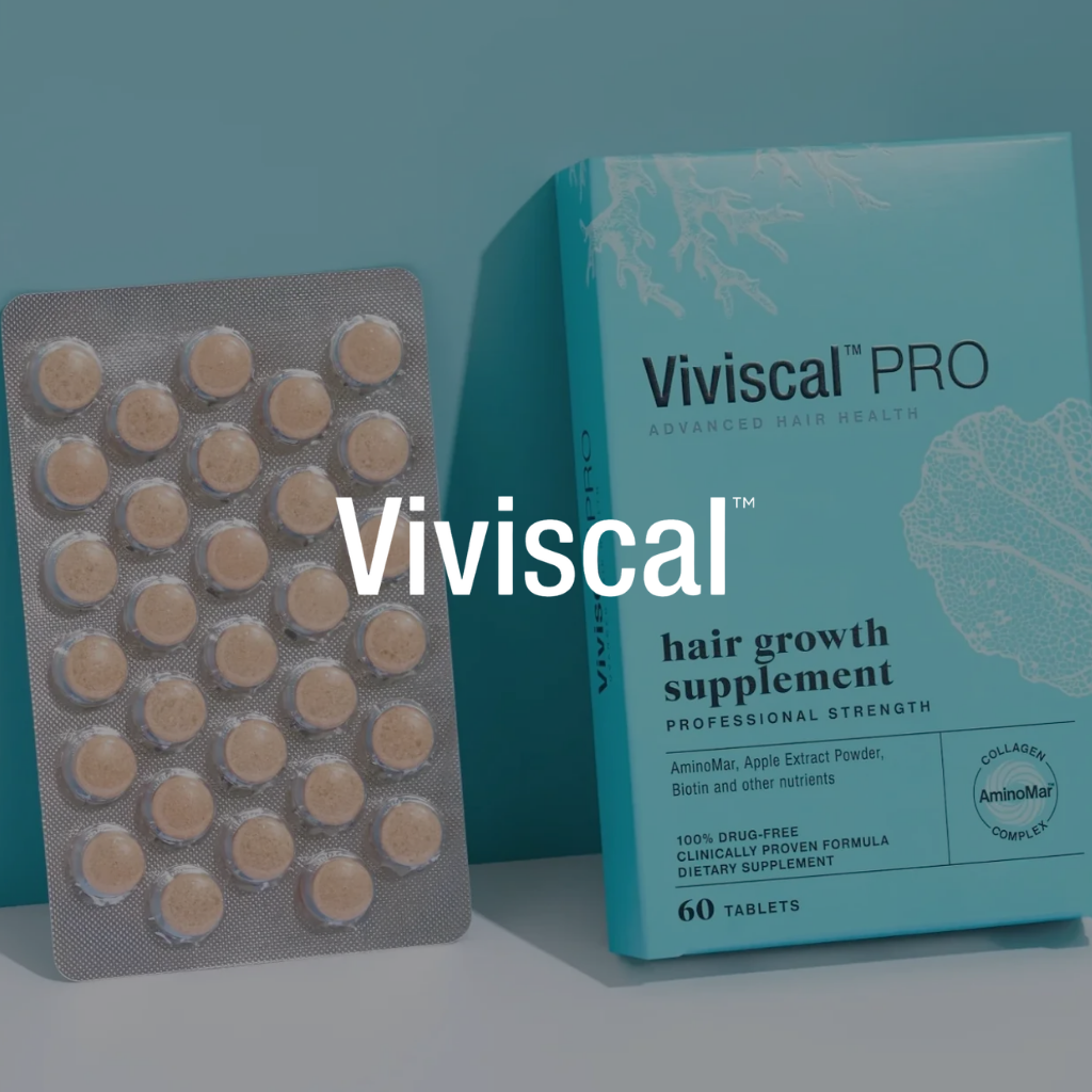 Blue box of Viviscal Pro hair growth supplement tablets beside a blister pack of round, beige tablets.