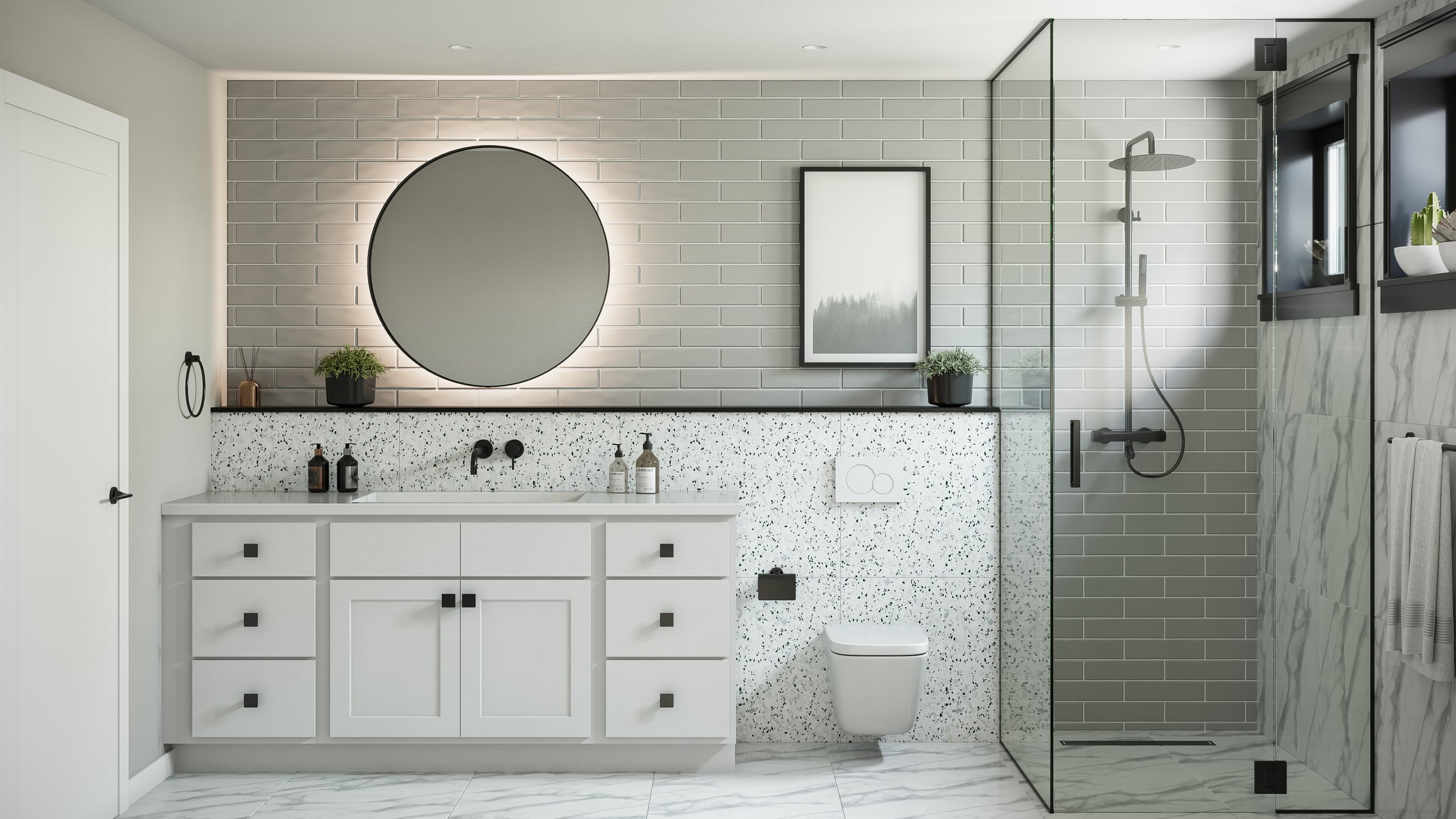 Modern bathroom with white vanity, round mirror, gray subway tile on wall, terrazzo countertop, framed art, small potted plants, and a glass-enclosed shower with rainfall showerhead.