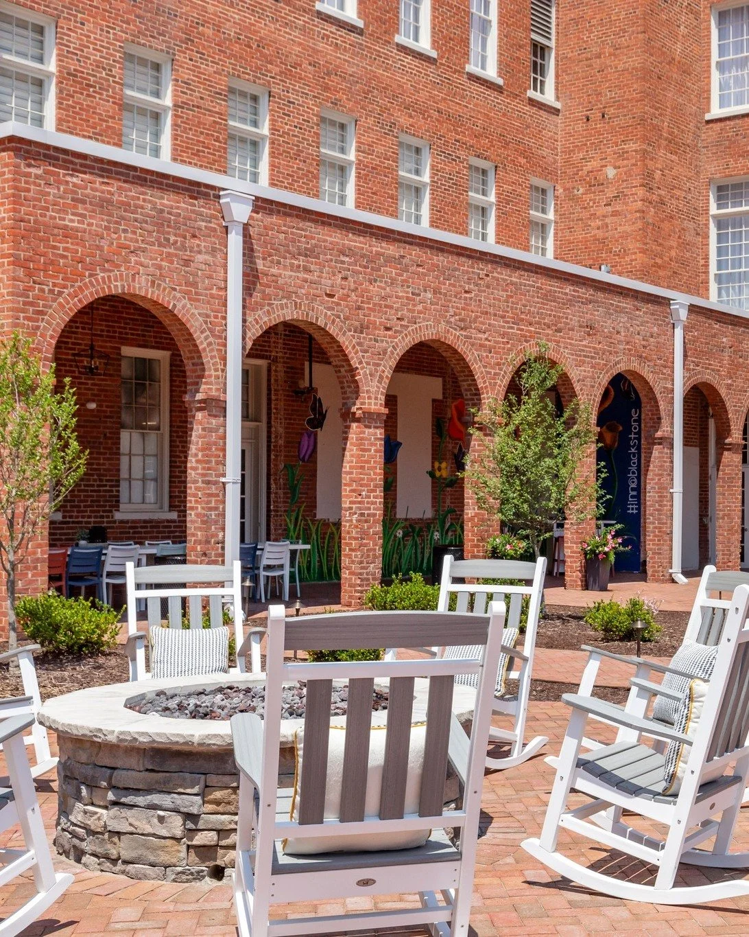 The ultimate spot to press pause. There is no better way to end your day at the Inn at Blackstone than sinking into a rocking chair in our back courtyard. Whether you're warming up by the fire pit under a blanket of stars, catching up with friends af