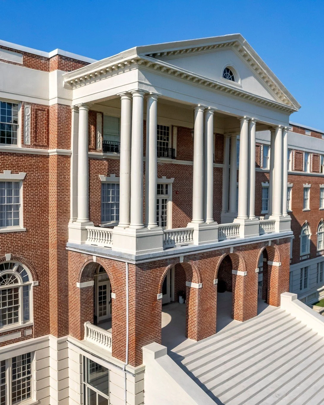 Built to stand the test of time. 🏛️From the red brick facade to the soaring white columns framing our front porch, the architecture of the Inn at Blackstone tells a story over a century in the making. Originally constructed as a historic women's col