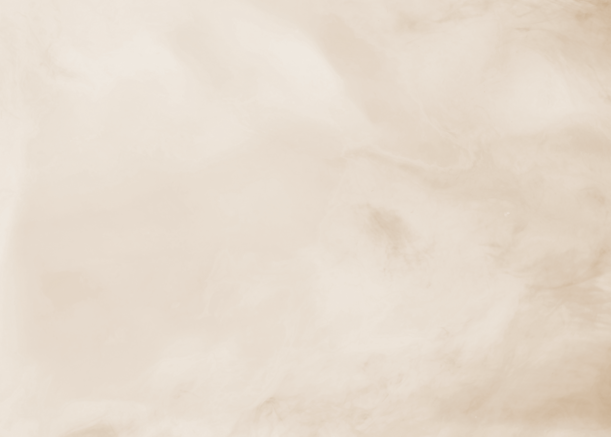A blank, beige-colored surface with subtle variations in shading and texture.